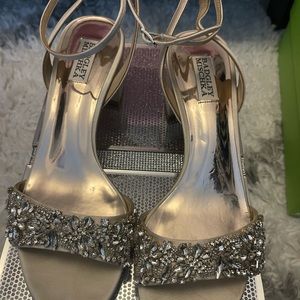 Baffles Mischka off white shoes with chunky heel an anklet buckle.